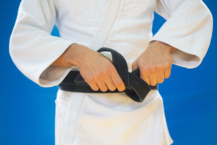 Man Tying His Black Belt