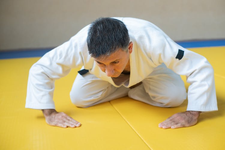 Man Wearing A Judo Uniform Bowing