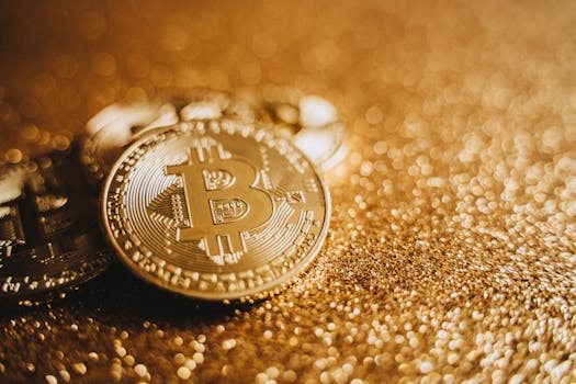 Detailed close-up of Bitcoin coins on a sparkling gold background, symbolizing digital currency and finance.