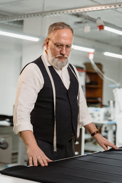 Man Looking at a Black Fabric