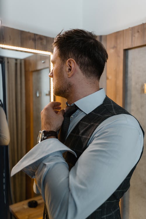 Man Fixing His Necktie