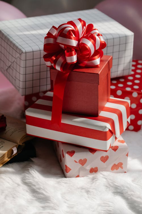 Bright red boxes of presents with ribbons