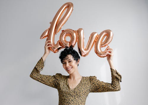 Happy woman with shiny balloon love