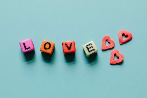 Free Letter Blocks and Heart Shape Candies Stock Photo