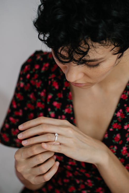 Free A Woman Looking at Her Engagement Ring Stock Photo