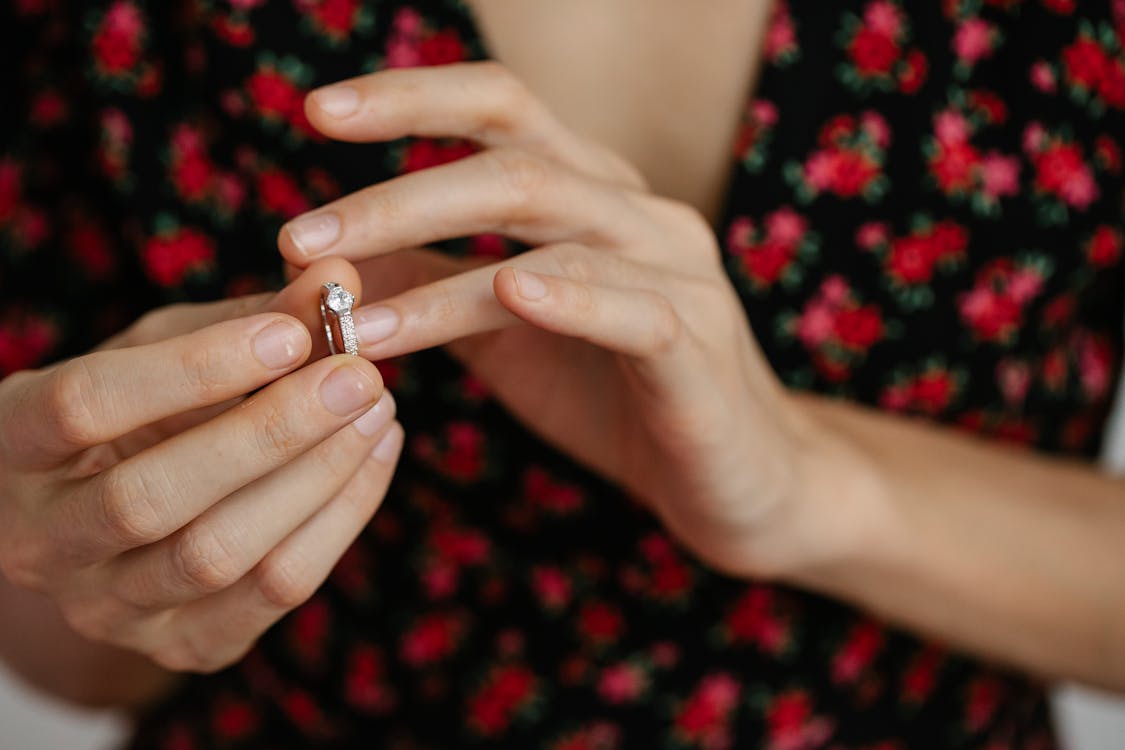 Free Woman Putting a Ring on a Finger Stock Photo