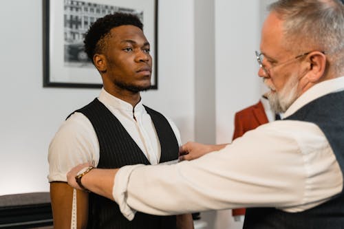 A Tailor Measuring a Client Torso