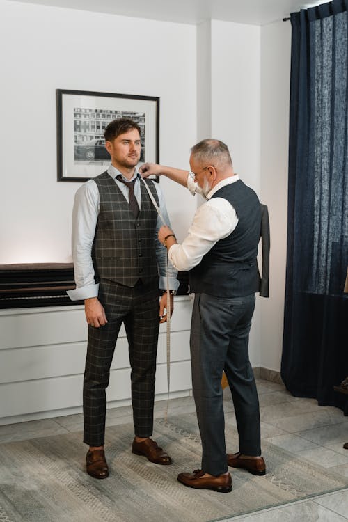 Free A Couturier Measuring a Man's Body
 Stock Photo
