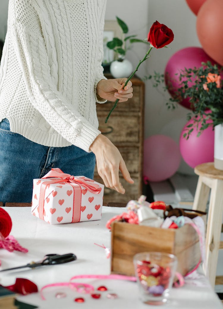 Crop Woman Packing Gifts And Flowers In Workshop