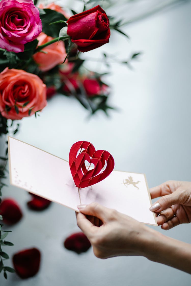 Crop Woman Showing Pop Up Gift Card With Decorative Heart