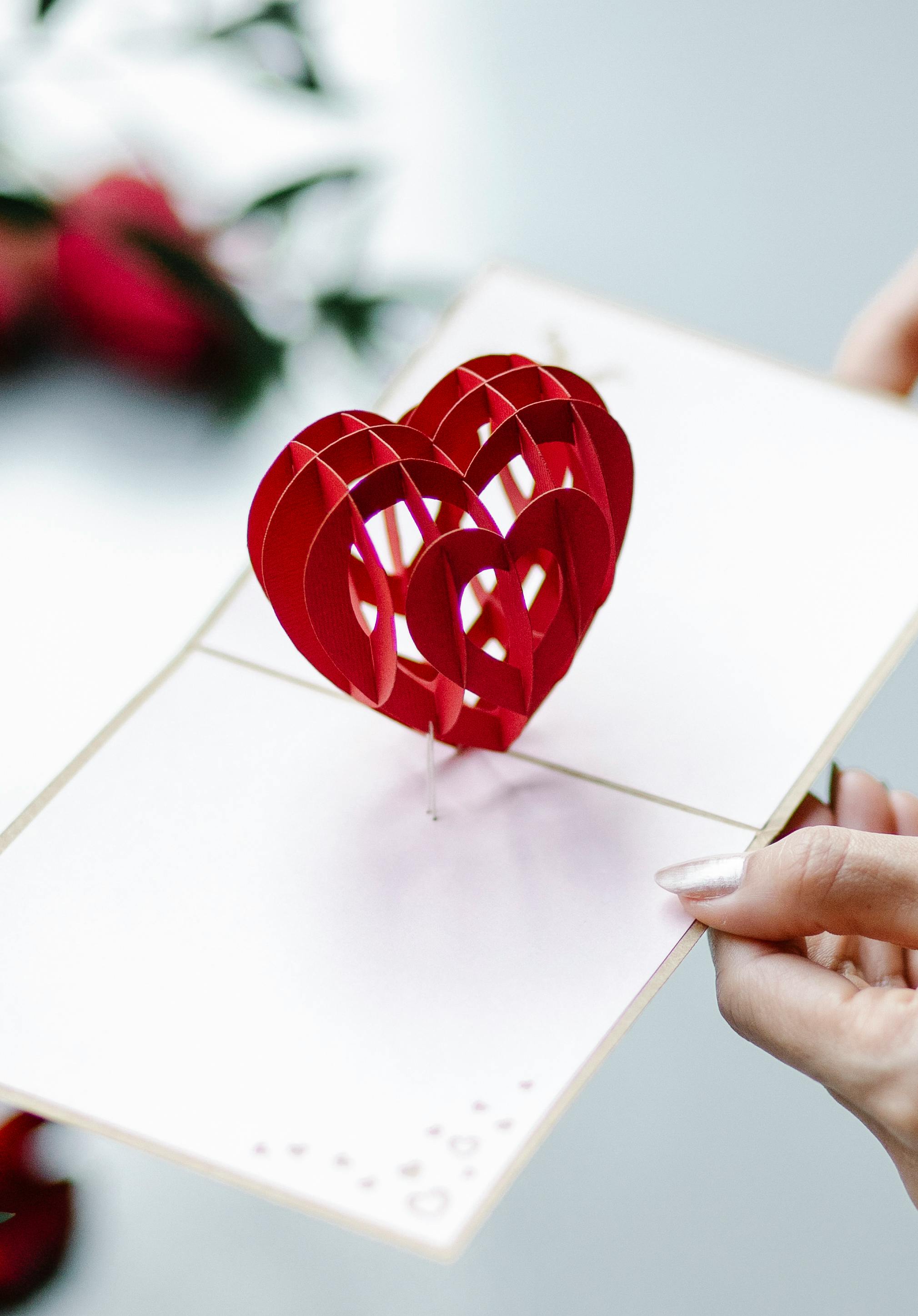 crop woman with valentines card