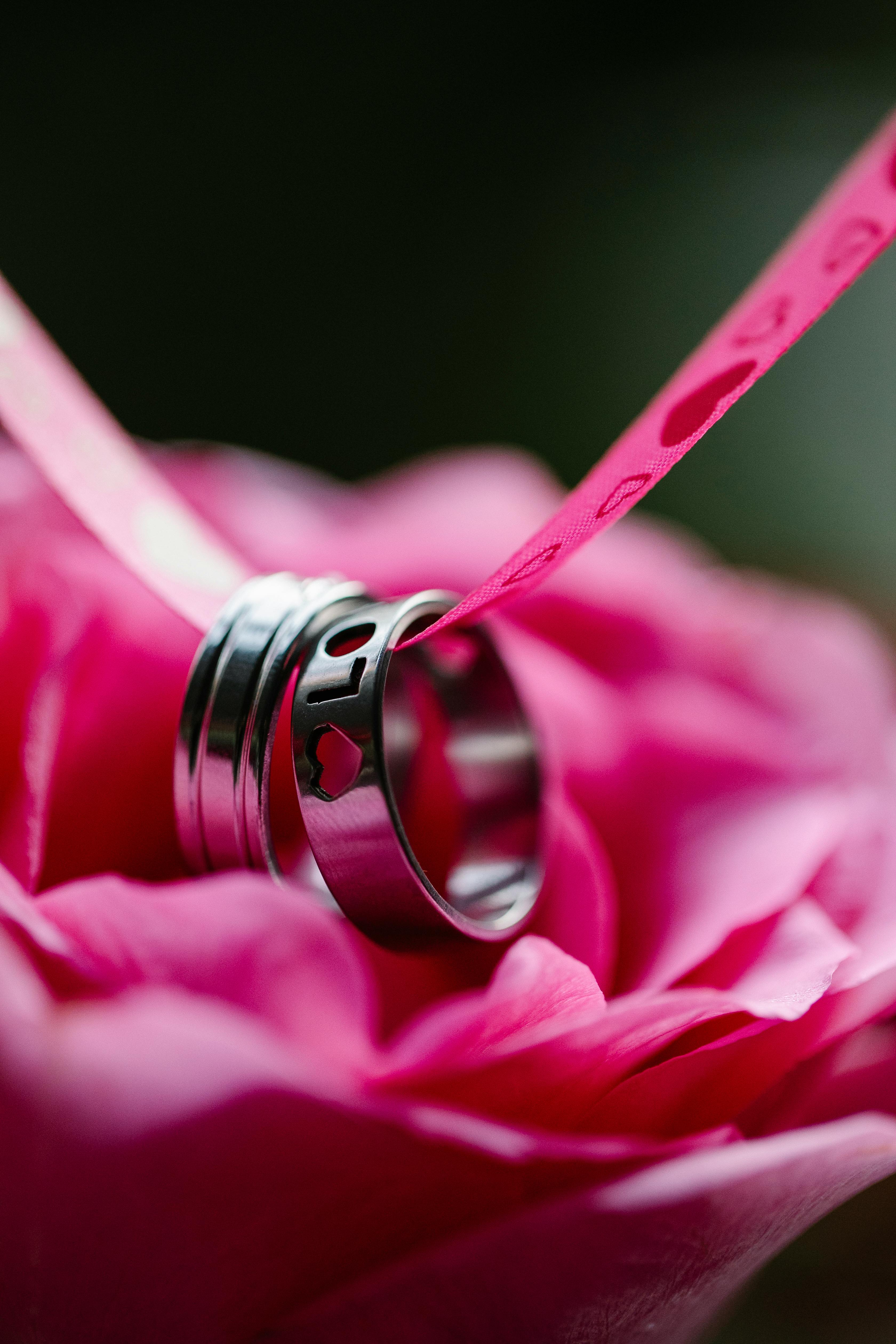 silver rings on blooming flower