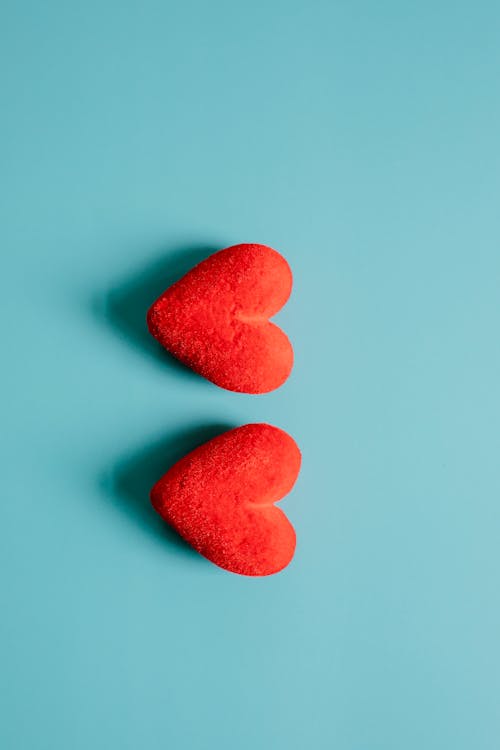 Free Red hearts on blue background Stock Photo