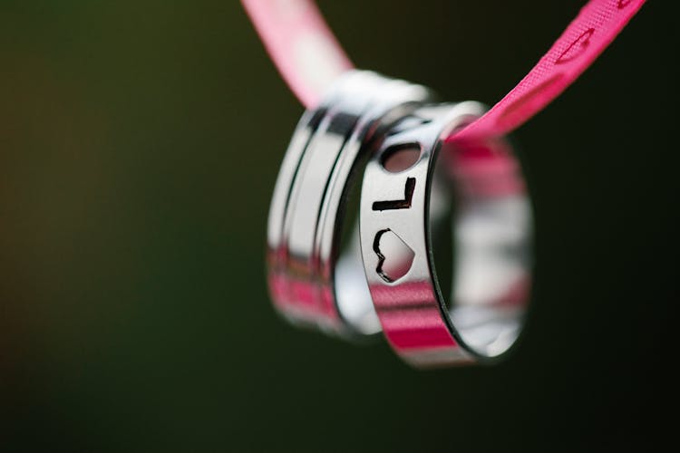 Engraved Rings Hanging On Ribbon