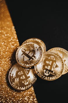Stack of golden Bitcoin coins on a sparkling gold and black backdrop, symbolizing cryptocurrency wealth.