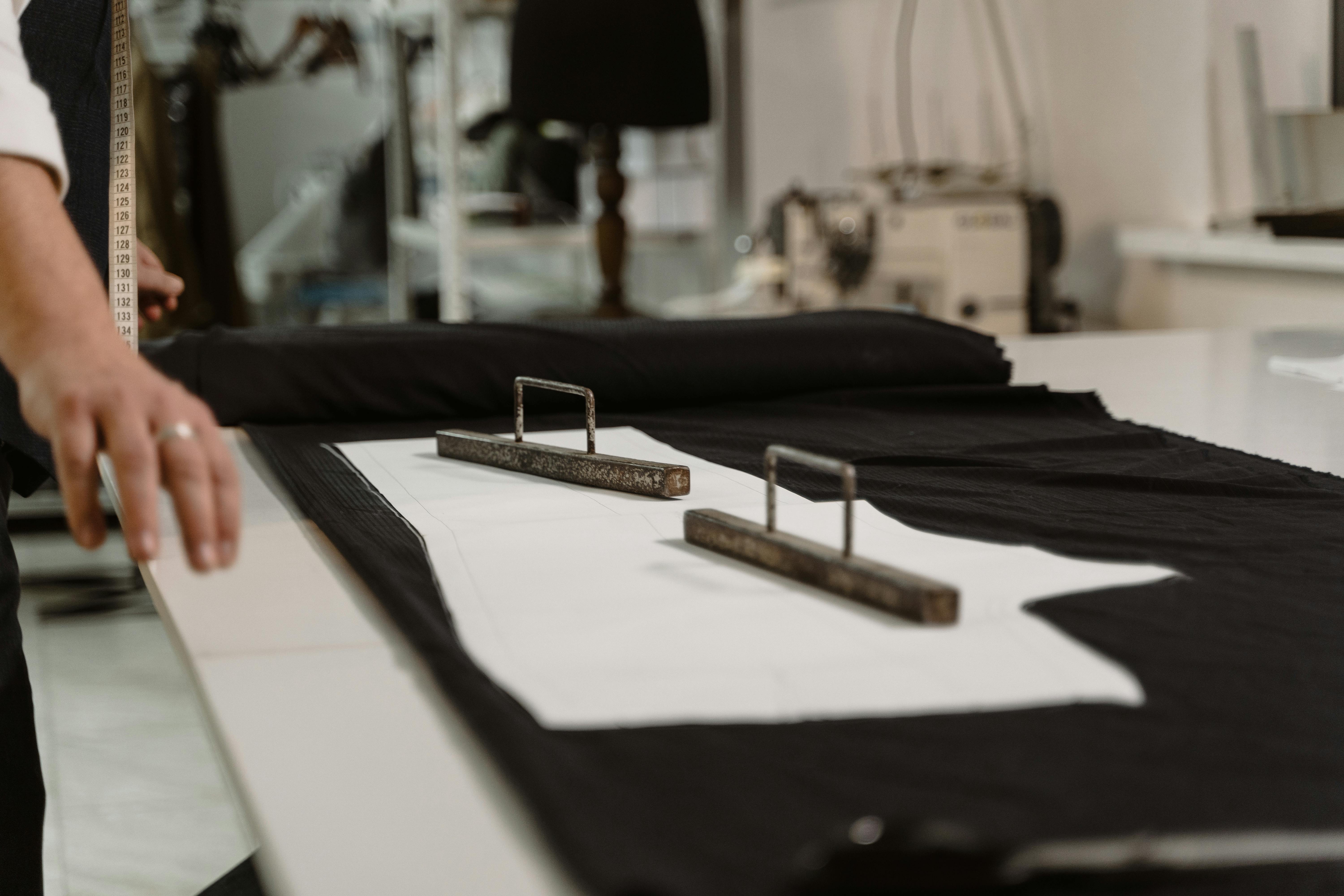 white and brown clothes hanger on white table