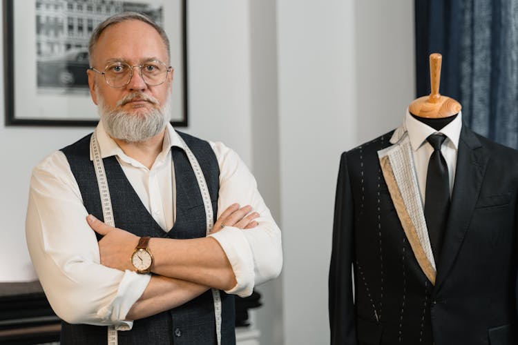 Elderly Man Standing Near A Mannequin