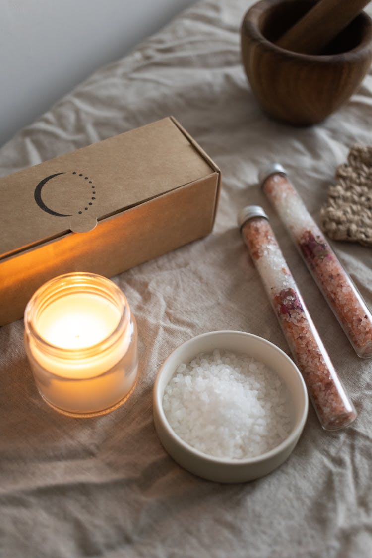 Close Up Of A Candle And Salt In A Bowl