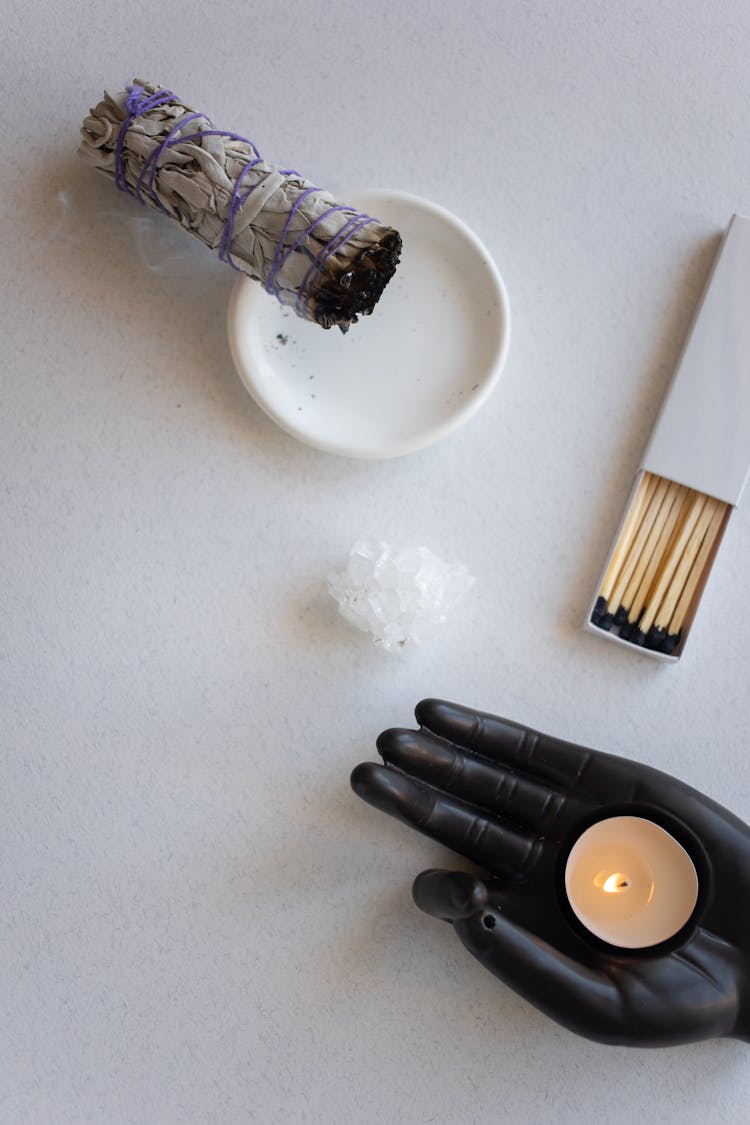 Smudge, Matches And A Tealight Candle And A Hand In Black Glove