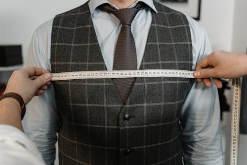 Tailor Measuring a Client's Chest