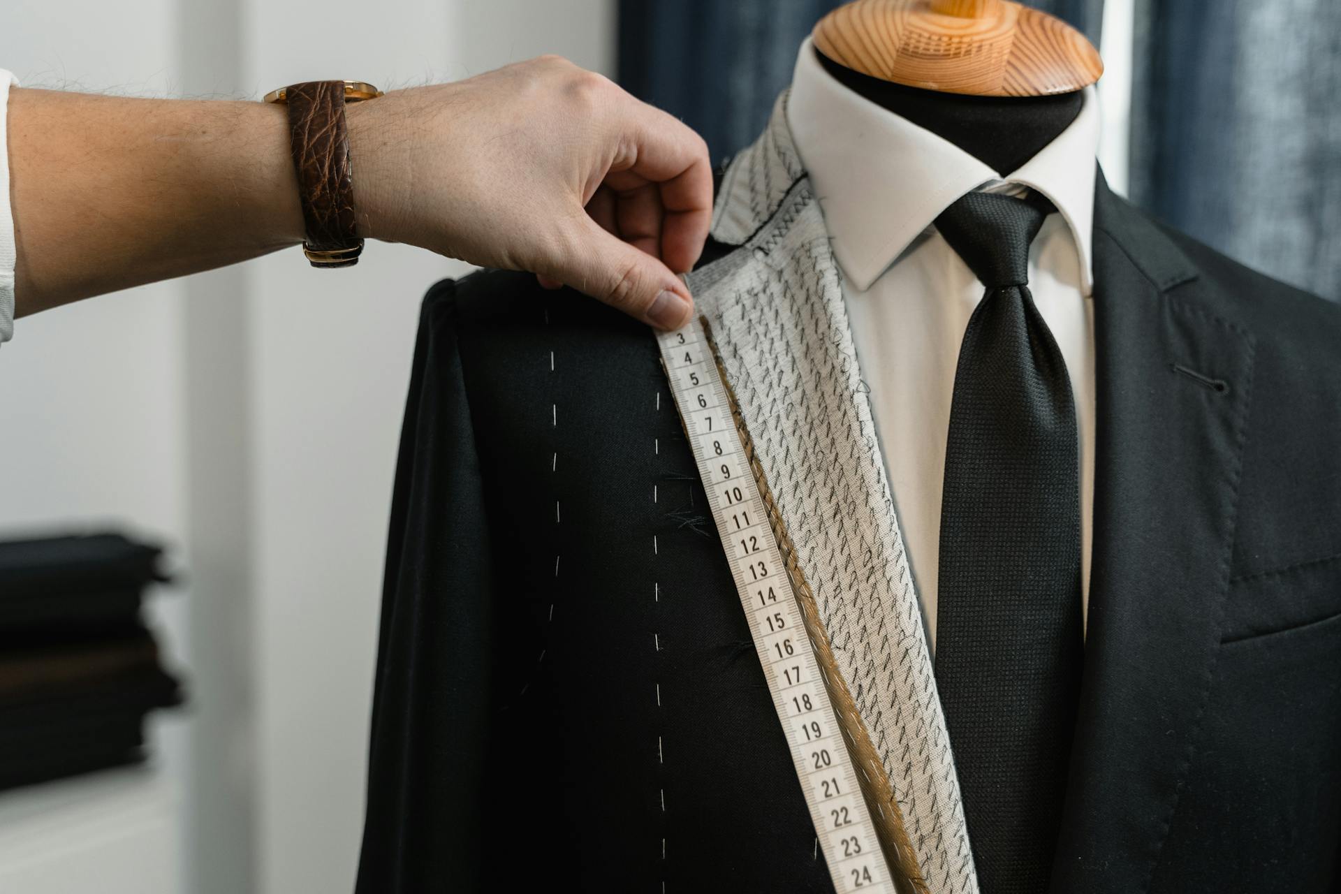 Couturier Measuring a Suit's Lapel