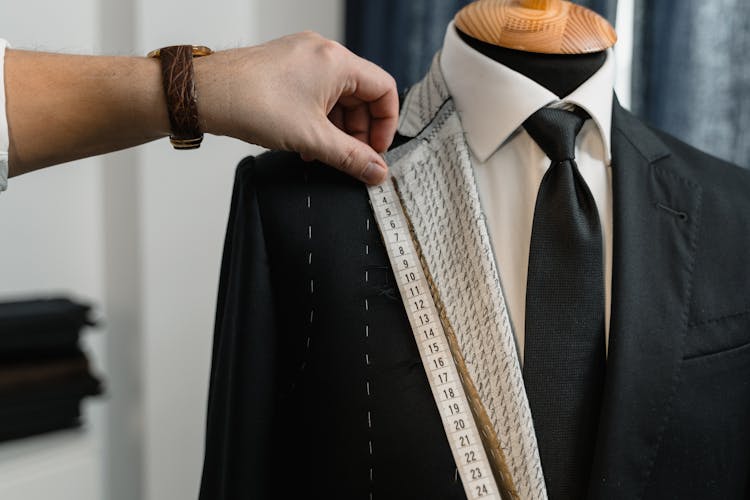 Couturier Measuring A Suit's Lapel