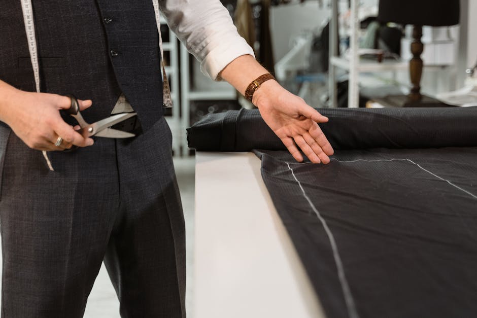 Tailor working quickly on a garment - same-day alterations San Diego Tailor working quickly on a garment - same-day alterations San Diego