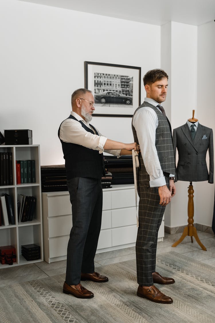 Couturier Measuring A Client