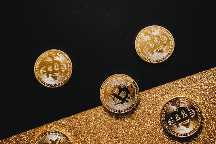 Gold Bitcoins On Black Surface