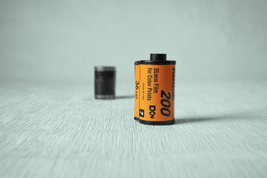 Close-up of a vintage 35mm film roll with a retro look against a textured background.