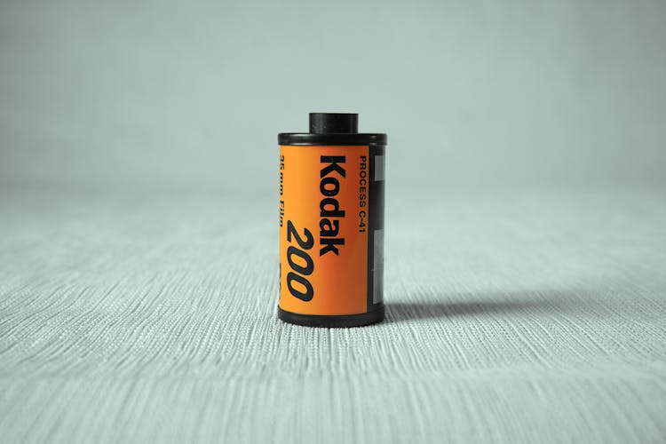 Photography Film In Orange Container