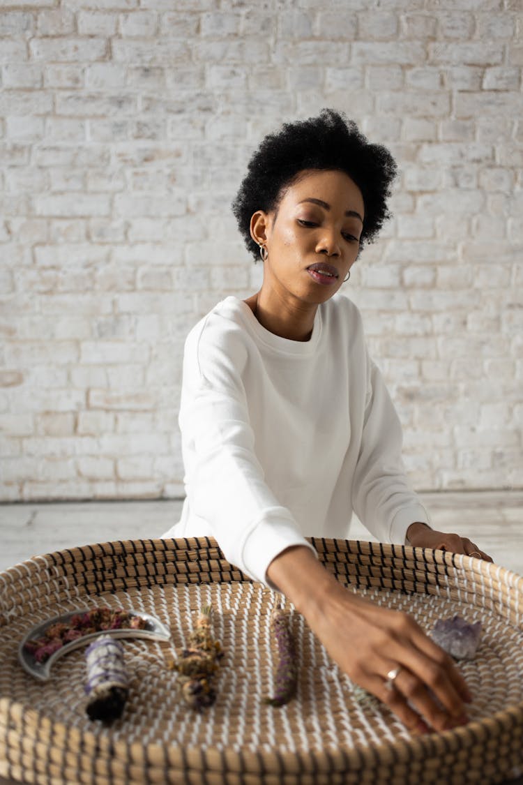 Woman In White Sweater Sitting Near Brown Woven Basket