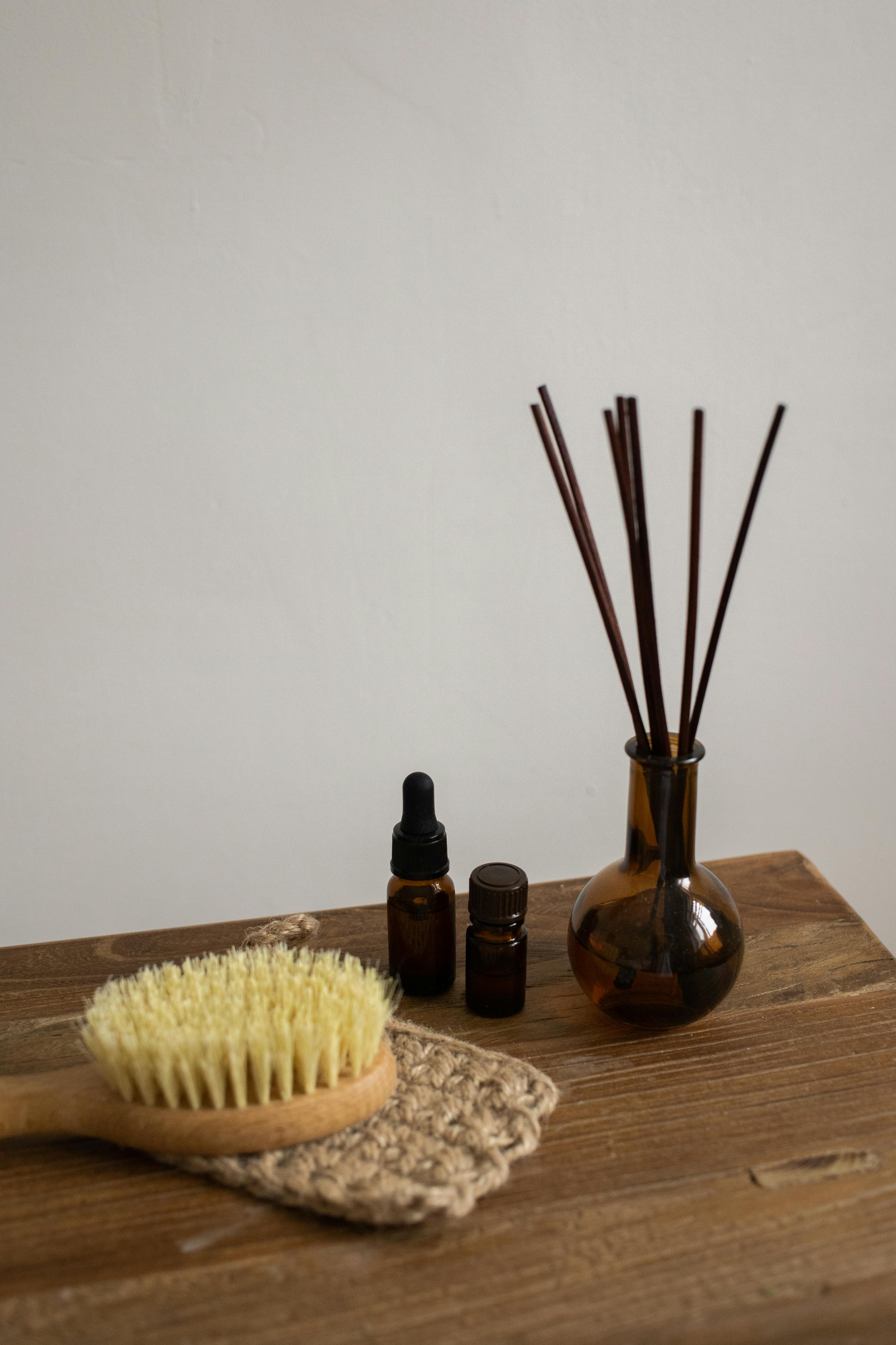 Incense Sticks, Essential Oils and a Brush · Free Stock Photo