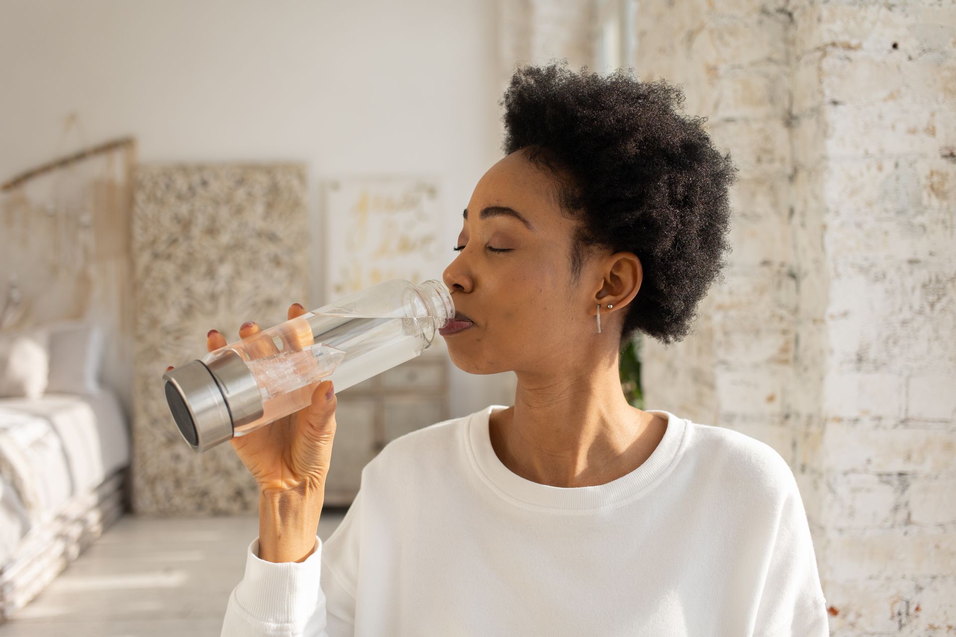 Woman Drinking Water from a Bottle
