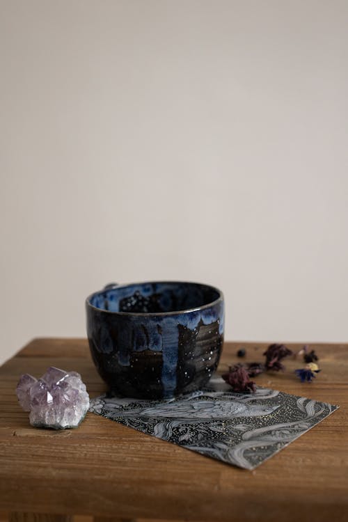 Cup and a Crystal on a Table