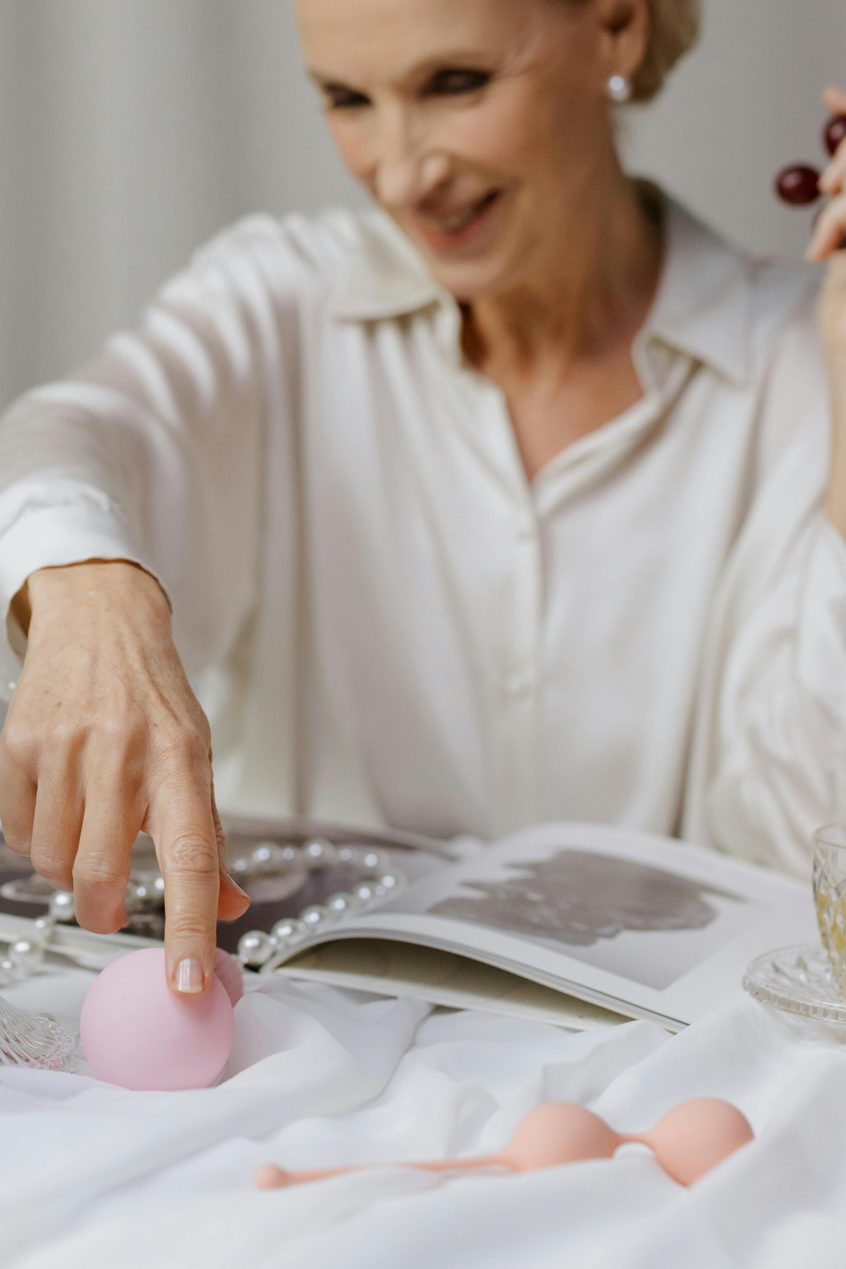 woman in white long sleeve shirt holding white ceramic plate