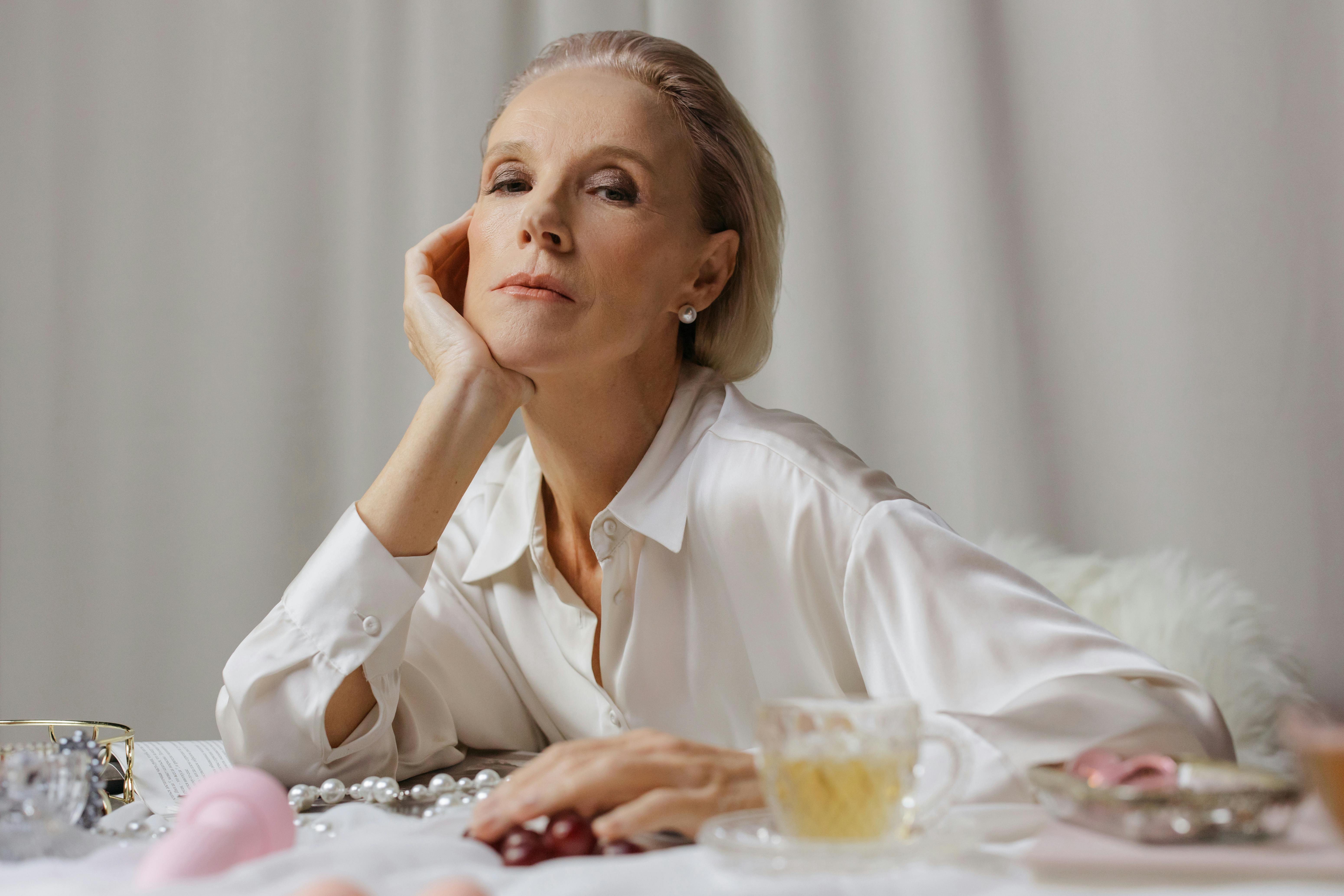 elegance woman leaning elbow on table with adults toy