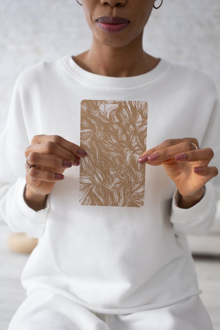 Woman Holding A Little Card With A Pattern 