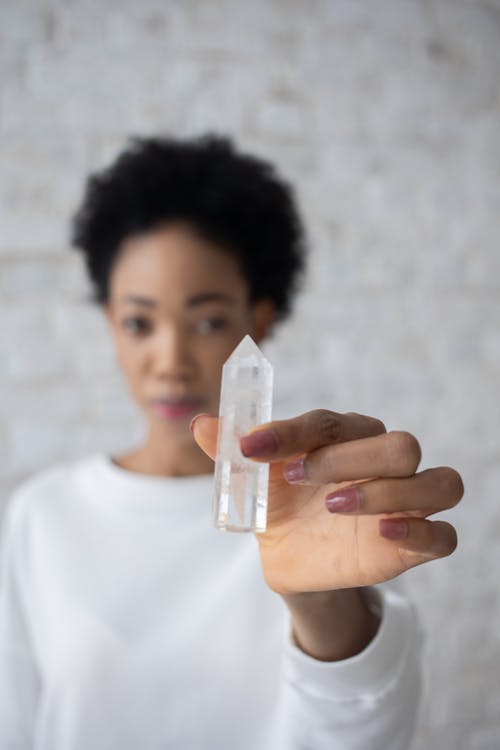 Hand of a Woman Holding a Crystal