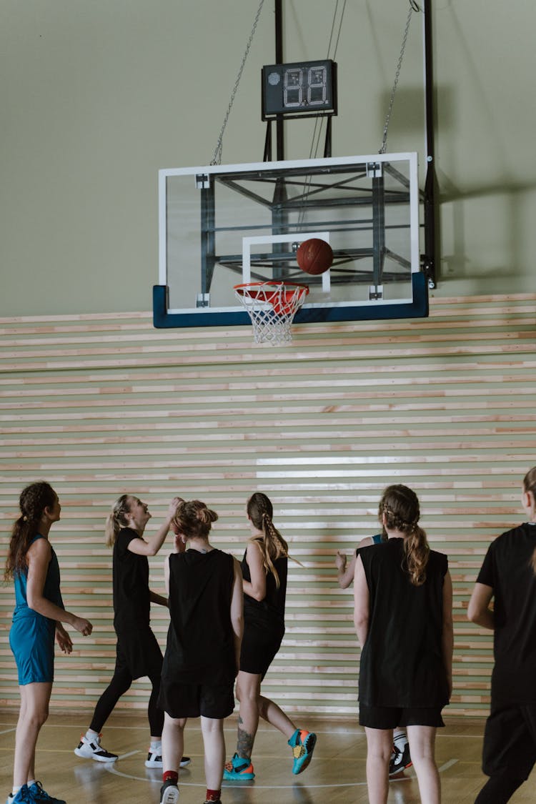 Group Of Women Playing Basketball