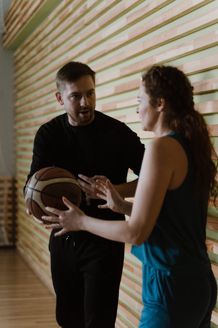 Basketball Coach Talking  To His Player