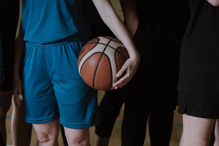 Hand Holding Basketball Ball