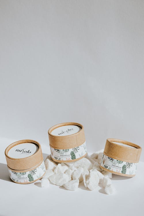 White and Brown Labelled Round Cardboard Boxes