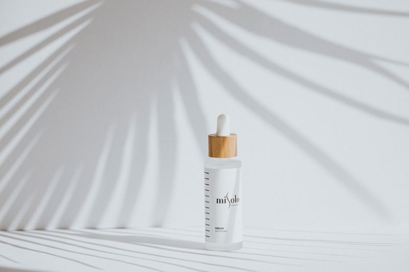 Minimalist skincare serum bottles on a clean surface