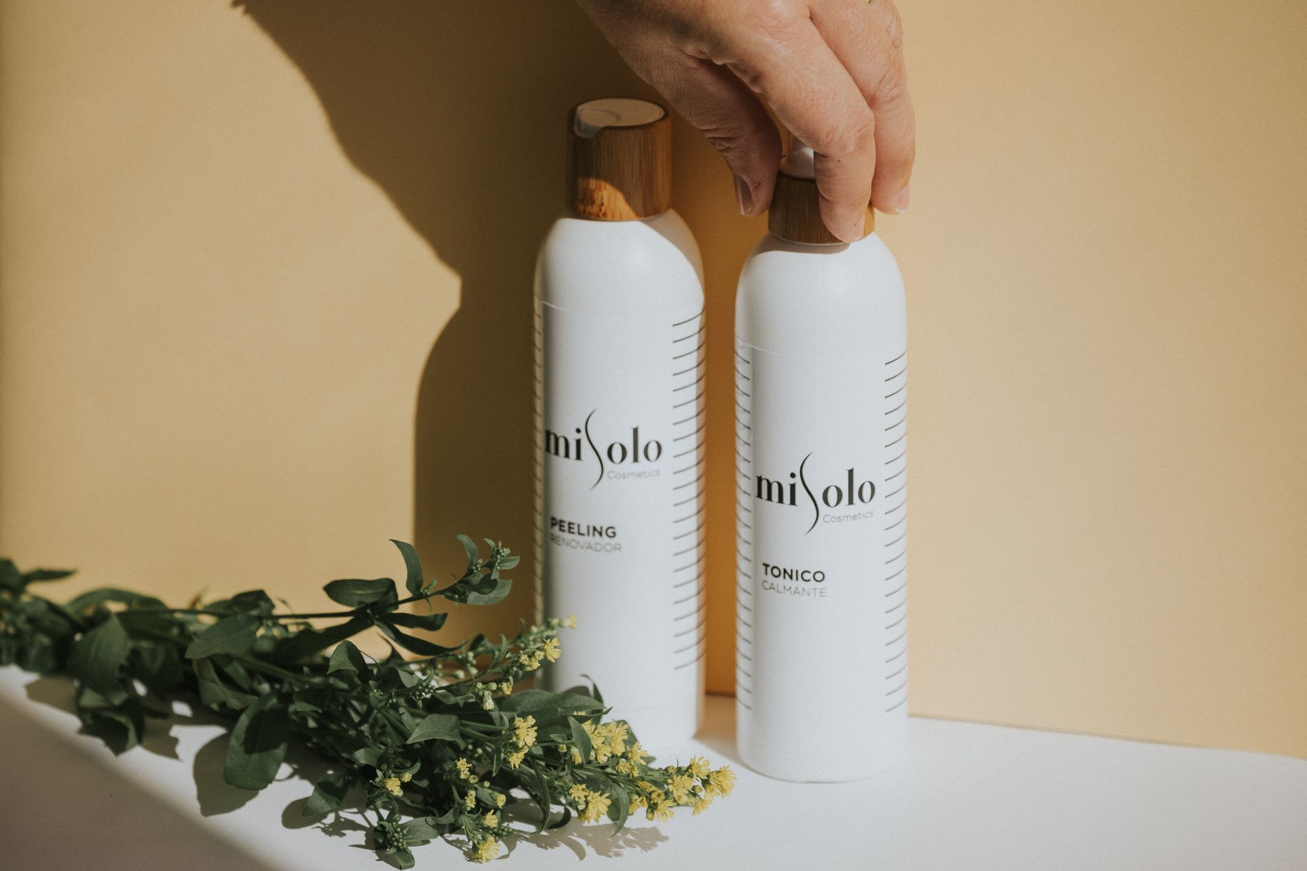 Botanical Renewal Duo — cosmetic bottles among greenery