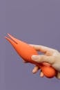 Close-Up Shot of a Person Holding an Adult Toy