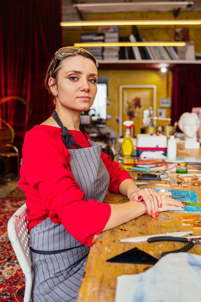 Woman artisan seated in her studio — photo by Antoni Shkraba on Pexels