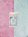 A Tarot Card om Blue and Pink Surface