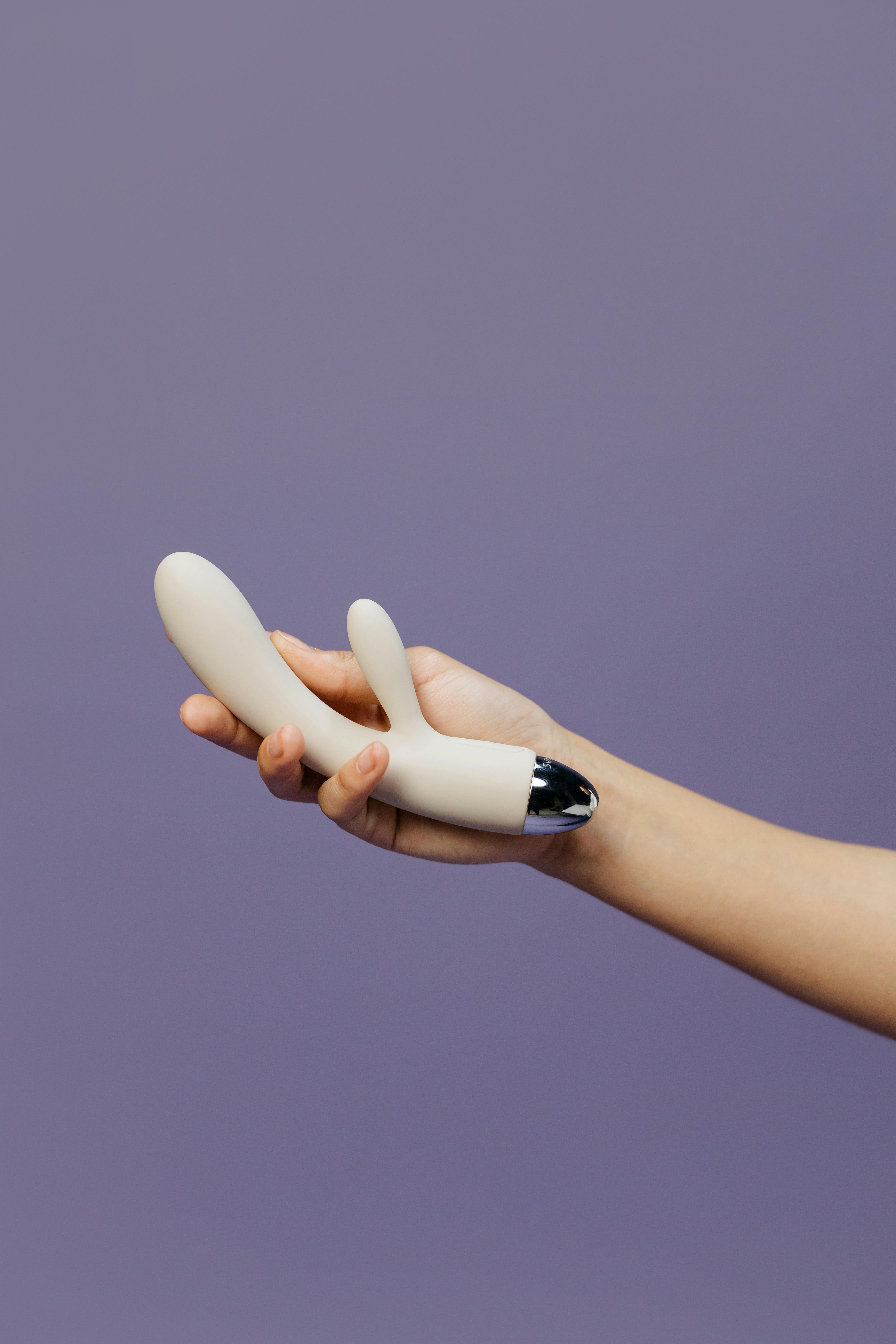 a person holding a vibrator