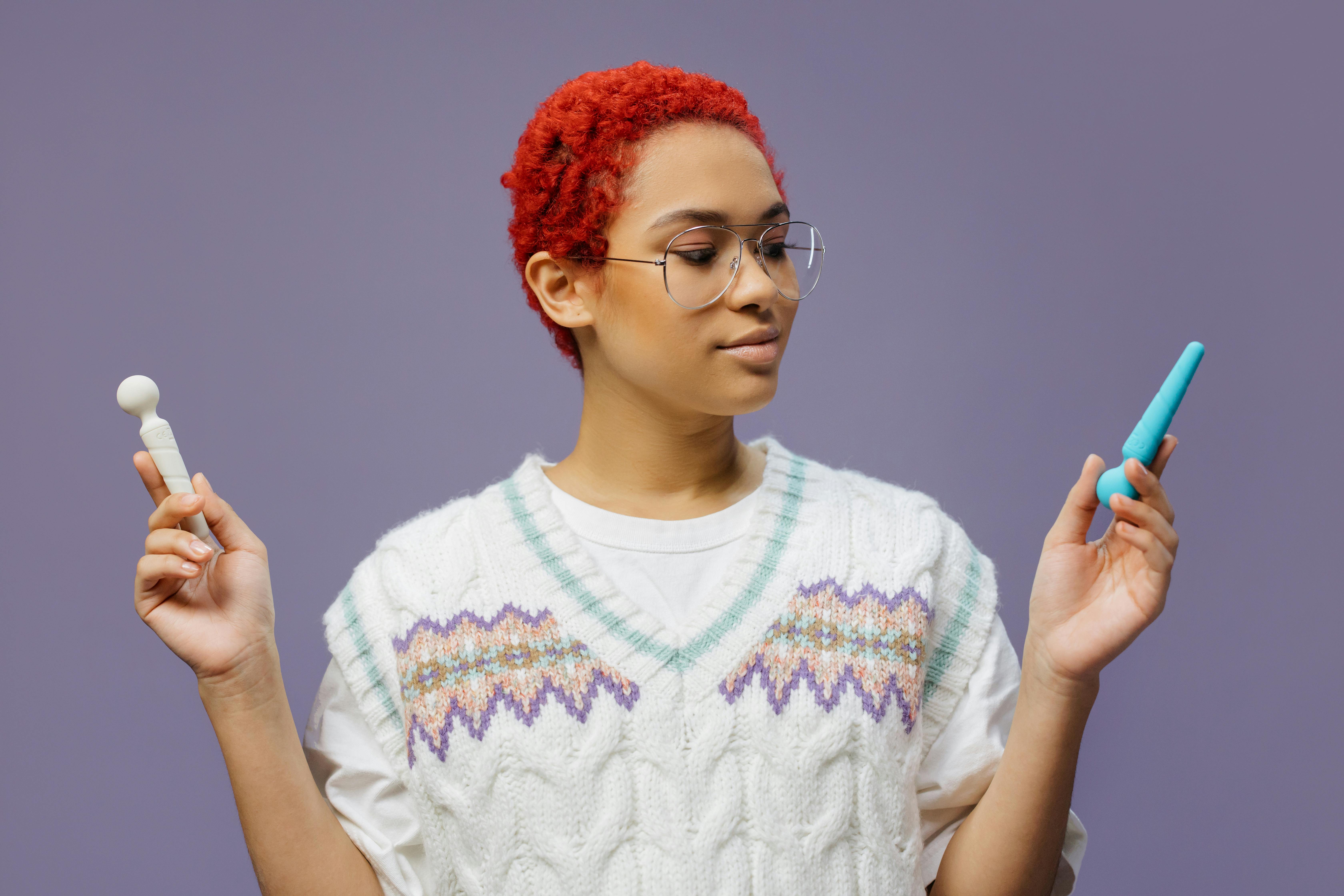 a woman holding adult toys